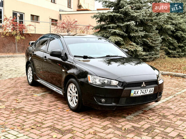Черный Мицубиси Лансер, объемом двигателя 2 л и пробегом 169 тыс. км за 6800 $, фото 1 на Automoto.ua