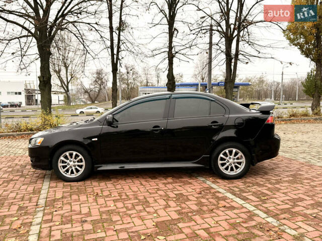 Черный Мицубиси Лансер, объемом двигателя 2 л и пробегом 169 тыс. км за 6800 $, фото 23 на Automoto.ua