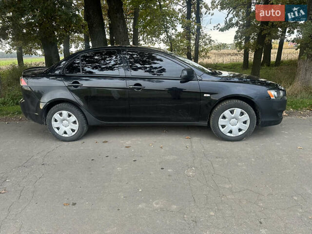 Черный Мицубиси Лансер, объемом двигателя 1.5 л и пробегом 202 тыс. км за 6500 $, фото 4 на Automoto.ua