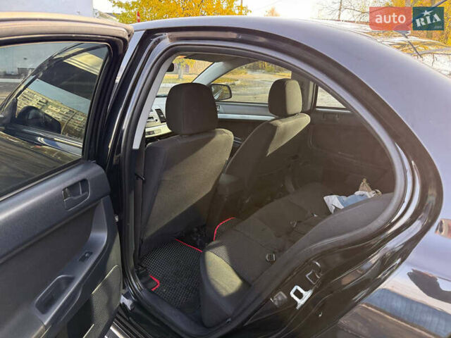 Мицубиси Лансер 2011 в Полтаве на Automoto.ua Черный Мицубиси Лансер, объемом двигателя 1.5 л и пробегом 246 тыс. км за 6300 $, фото 8 на Automoto.ua