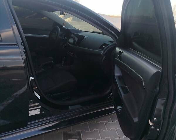 Чорний Міцубісі Lancer, об'ємом двигуна 2 л та пробігом 286 тис. км за 7950 $, фото 5 на Automoto.ua