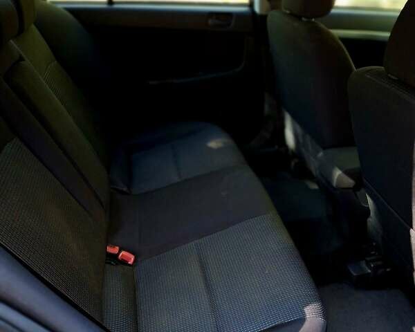 Чорний Міцубісі Lancer, об'ємом двигуна 1.5 л та пробігом 90 тис. км за 7699 $, фото 11 на Automoto.ua