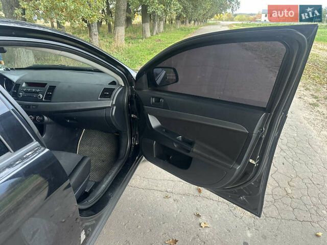 Черный Мицубиси Лансер, объемом двигателя 1.5 л и пробегом 202 тыс. км за 6500 $, фото 22 на Automoto.ua