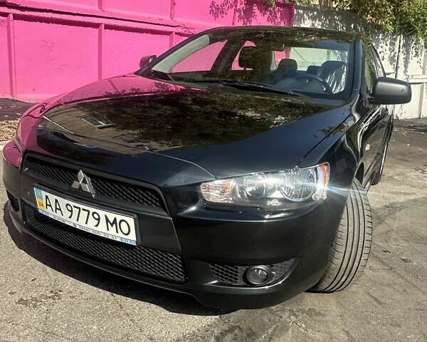 Черный Мицубиси Лансер, объемом двигателя 2 л и пробегом 158 тыс. км за 10800 $, фото 1 на Automoto.ua