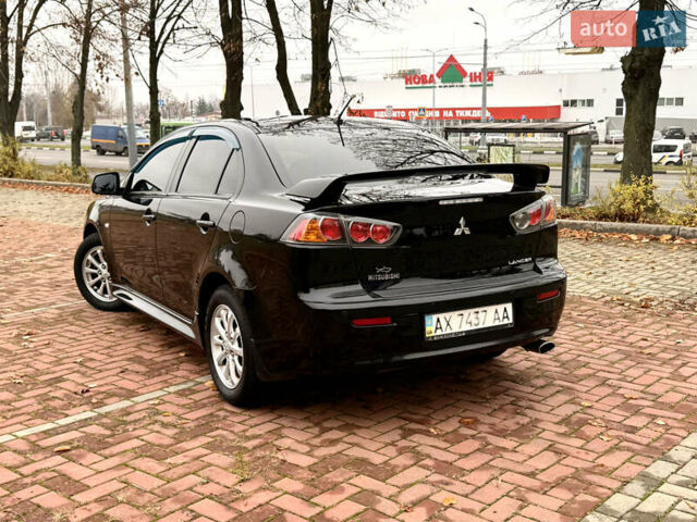 Черный Мицубиси Лансер, объемом двигателя 2 л и пробегом 169 тыс. км за 6800 $, фото 4 на Automoto.ua