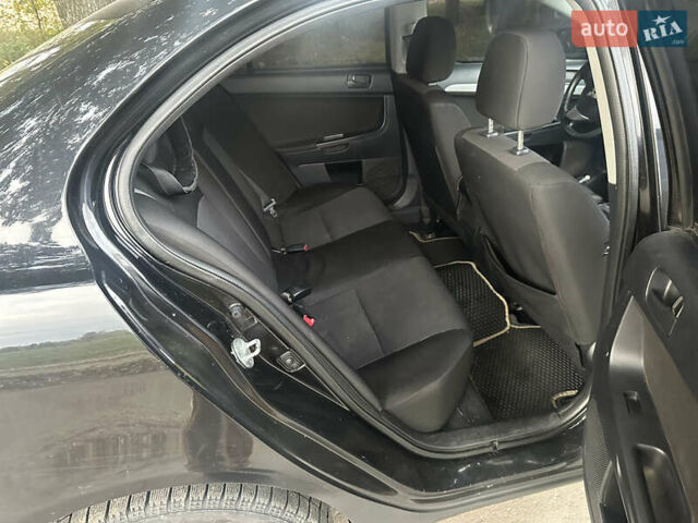 Черный Мицубиси Лансер, объемом двигателя 1.5 л и пробегом 202 тыс. км за 6500 $, фото 31 на Automoto.ua