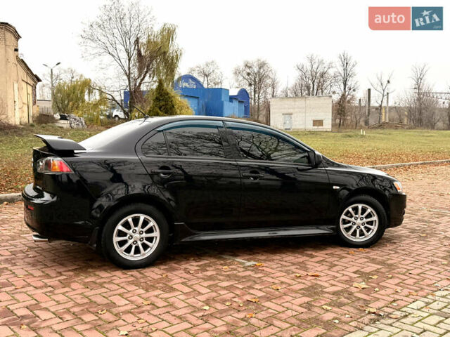 Черный Мицубиси Лансер, объемом двигателя 2 л и пробегом 169 тыс. км за 6800 $, фото 5 на Automoto.ua
