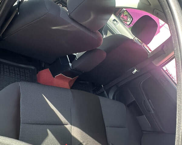 Черный Мицубиси Лансер, объемом двигателя 2 л и пробегом 158 тыс. км за 10800 $, фото 5 на Automoto.ua