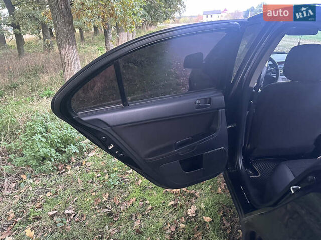 Черный Мицубиси Лансер, объемом двигателя 1.5 л и пробегом 202 тыс. км за 6500 $, фото 24 на Automoto.ua