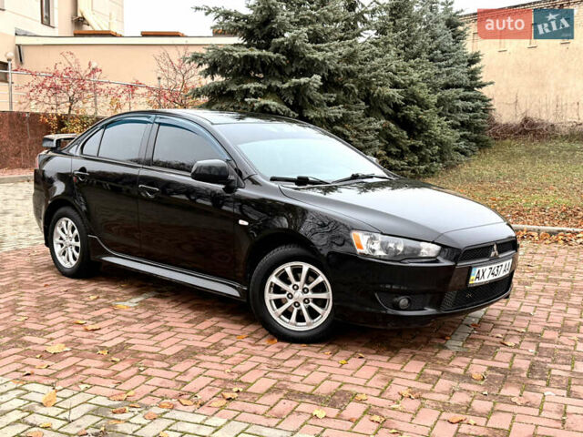 Черный Мицубиси Лансер, объемом двигателя 2 л и пробегом 169 тыс. км за 6800 $, фото 20 на Automoto.ua