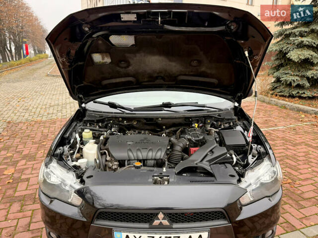 Черный Мицубиси Лансер, объемом двигателя 2 л и пробегом 169 тыс. км за 6800 $, фото 30 на Automoto.ua
