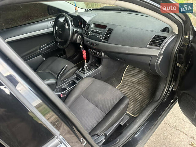 Черный Мицубиси Лансер, объемом двигателя 1.5 л и пробегом 202 тыс. км за 6500 $, фото 30 на Automoto.ua