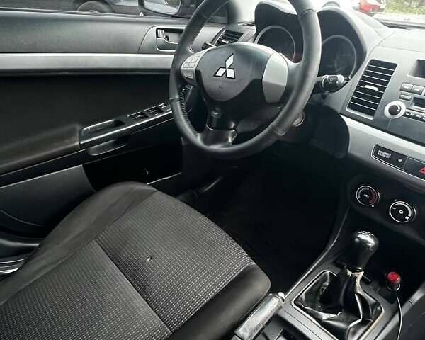 Черный Мицубиси Лансер, объемом двигателя 1.5 л и пробегом 250 тыс. км за 4800 $, фото 8 на Automoto.ua