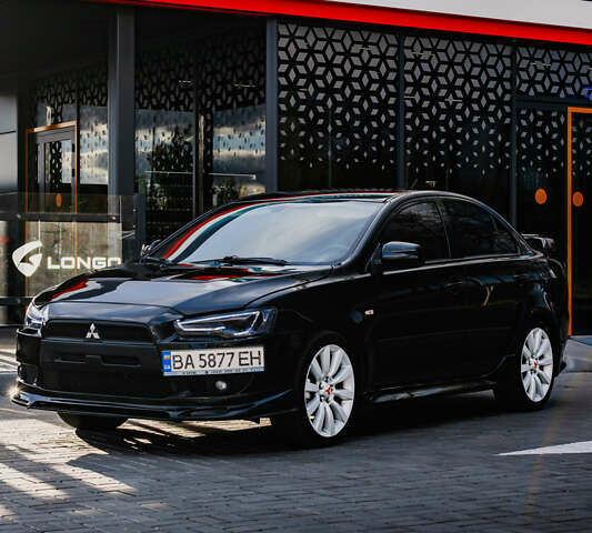 Чорний Міцубісі Lancer, об'ємом двигуна 2 л та пробігом 204 тис. км за 9500 $, фото 56 на Automoto.ua