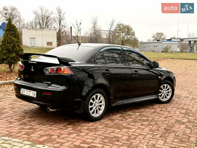 Черный Мицубиси Лансер, объемом двигателя 2 л и пробегом 169 тыс. км за 6800 $, фото 13 на Automoto.ua