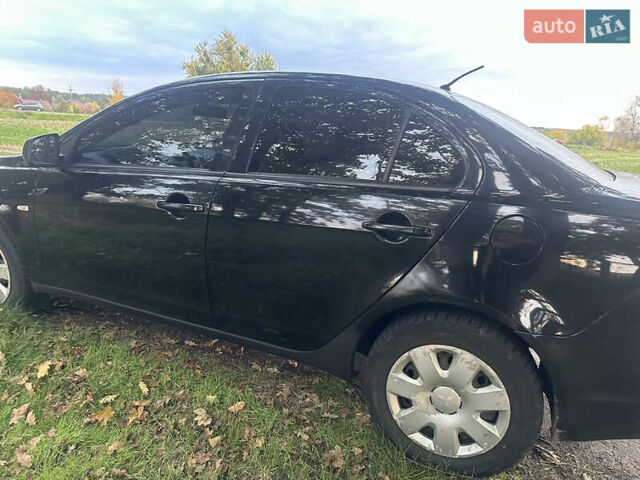 Черный Мицубиси Лансер, объемом двигателя 1.5 л и пробегом 202 тыс. км за 6500 $, фото 9 на Automoto.ua