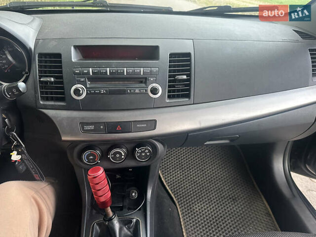 Черный Мицубиси Лансер, объемом двигателя 1.5 л и пробегом 202 тыс. км за 6500 $, фото 37 на Automoto.ua