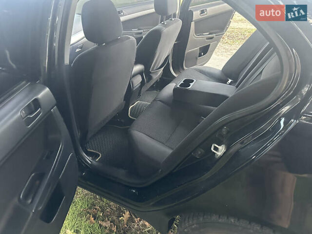 Черный Мицубиси Лансер, объемом двигателя 1.5 л и пробегом 202 тыс. км за 6500 $, фото 27 на Automoto.ua