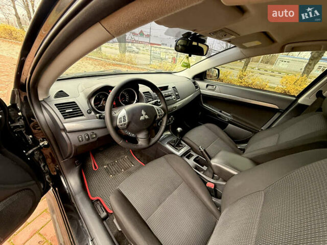 Черный Мицубиси Лансер, объемом двигателя 2 л и пробегом 169 тыс. км за 6800 $, фото 27 на Automoto.ua