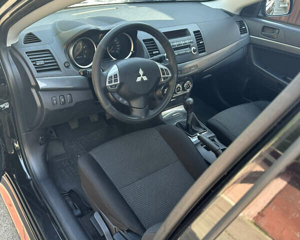 Черный Мицубиси Лансер, объемом двигателя 2 л и пробегом 158 тыс. км за 10800 $, фото 7 на Automoto.ua