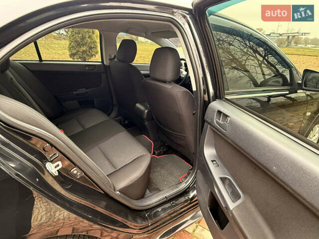 Черный Мицубиси Лансер, объемом двигателя 2 л и пробегом 169 тыс. км за 6800 $, фото 33 на Automoto.ua