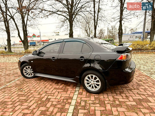 Черный Мицубиси Лансер, объемом двигателя 2 л и пробегом 169 тыс. км за 6800 $, фото 15 на Automoto.ua