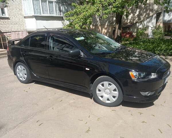 Мицубиси Лансер 2011 в Кропивницком (Кировограде) на Automoto.ua Черный Мицубиси Лансер, объемом двигателя 1.5 л и пробегом 150 тыс. км за 7000 $, фото 6 на Automoto.ua