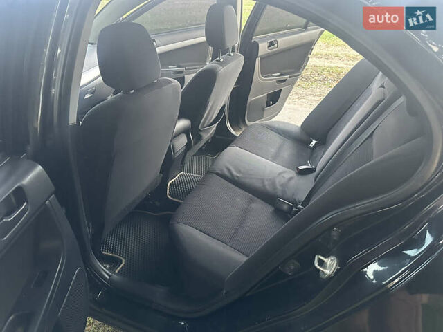 Черный Мицубиси Лансер, объемом двигателя 1.5 л и пробегом 202 тыс. км за 6500 $, фото 33 на Automoto.ua