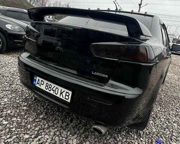 Черный Мицубиси Лансер, объемом двигателя 1.5 л и пробегом 250 тыс. км за 4800 $, фото 3 на Automoto.ua