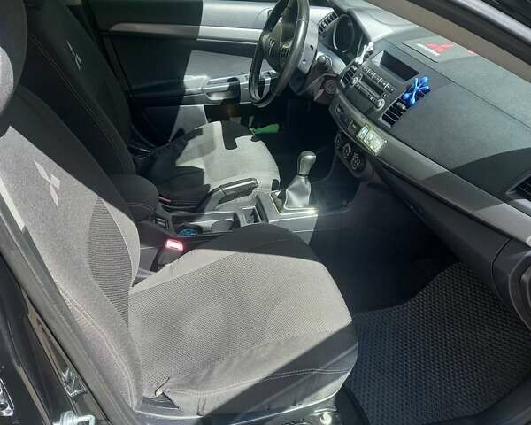 Мицубиси Лансер 2011 в Кропивницком (Кировограде) на Automoto.ua Черный Мицубиси Лансер, объемом двигателя 1.5 л и пробегом 150 тыс. км за 7000 $, фото 3 на Automoto.ua
