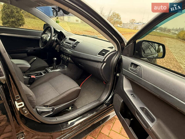 Черный Мицубиси Лансер, объемом двигателя 2 л и пробегом 169 тыс. км за 6800 $, фото 32 на Automoto.ua