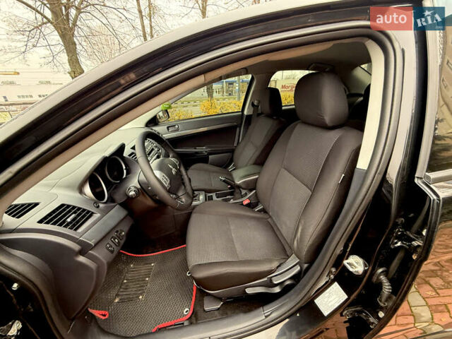 Черный Мицубиси Лансер, объемом двигателя 2 л и пробегом 169 тыс. км за 6800 $, фото 26 на Automoto.ua