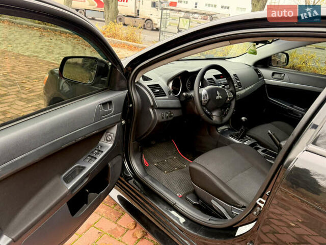 Черный Мицубиси Лансер, объемом двигателя 2 л и пробегом 169 тыс. км за 6800 $, фото 25 на Automoto.ua