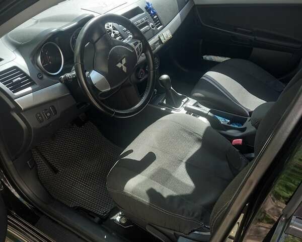 Мицубиси Лансер 2011 в Кропивницком (Кировограде) на Automoto.ua Черный Мицубиси Лансер, объемом двигателя 1.5 л и пробегом 150 тыс. км за 7000 $, фото 4 на Automoto.ua
