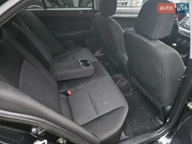 Черный Мицубиси Лансер, объемом двигателя 1.5 л и пробегом 222 тыс. км за 4900 $, фото 16 на Automoto.ua