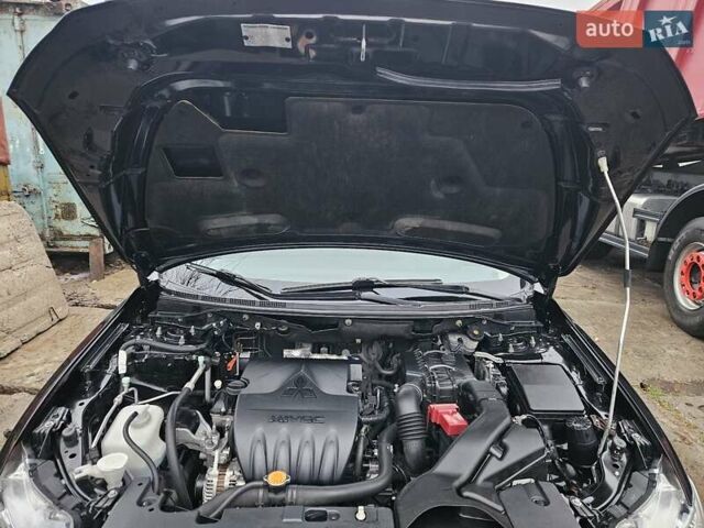Черный Мицубиси Лансер, объемом двигателя 1.5 л и пробегом 222 тыс. км за 4900 $, фото 9 на Automoto.ua