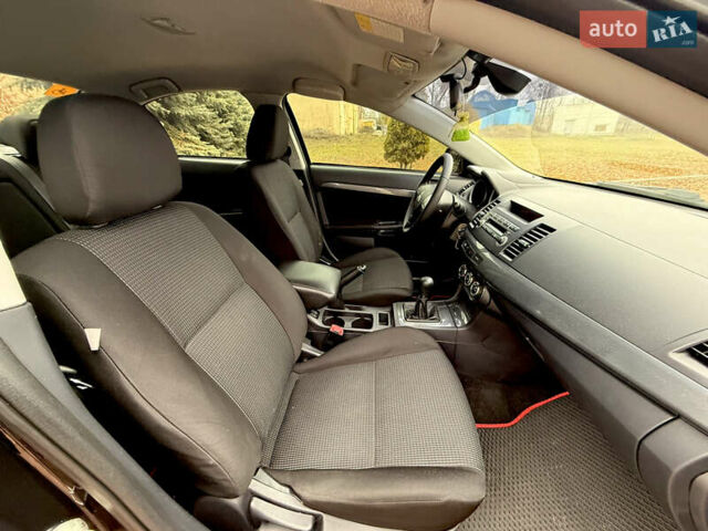 Черный Мицубиси Лансер, объемом двигателя 2 л и пробегом 169 тыс. км за 6800 $, фото 31 на Automoto.ua