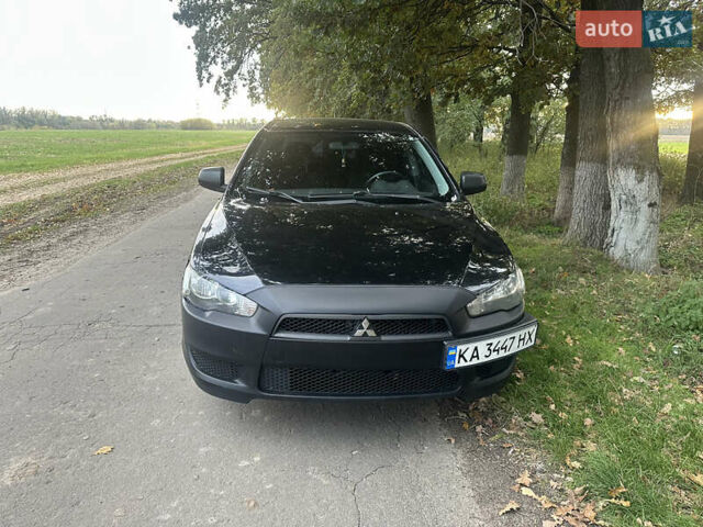 Черный Мицубиси Лансер, объемом двигателя 1.5 л и пробегом 202 тыс. км за 6500 $, фото 1 на Automoto.ua