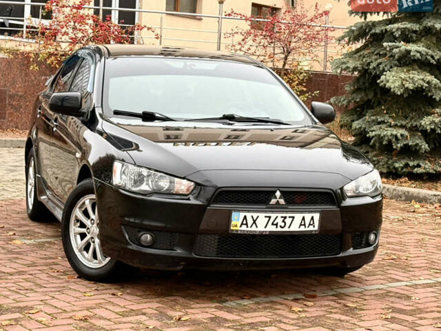 Черный Мицубиси Лансер, объемом двигателя 2 л и пробегом 169 тыс. км за 6800 $, фото 3 на Automoto.ua