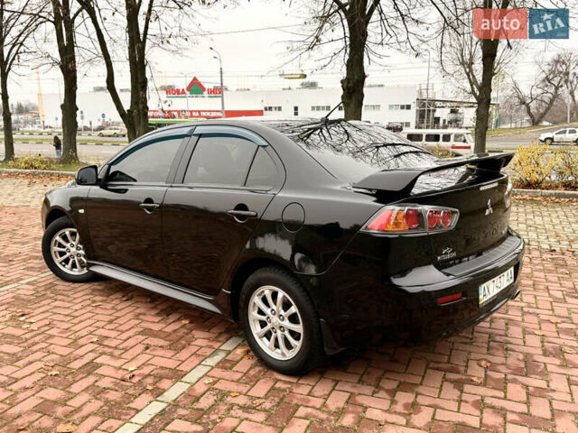 Черный Мицубиси Лансер, объемом двигателя 2 л и пробегом 169 тыс. км за 6800 $, фото 16 на Automoto.ua