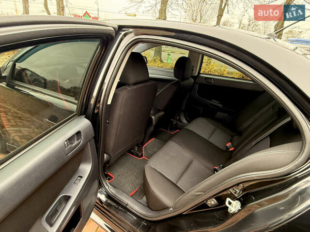 Черный Мицубиси Лансер, объемом двигателя 2 л и пробегом 169 тыс. км за 6800 $, фото 29 на Automoto.ua