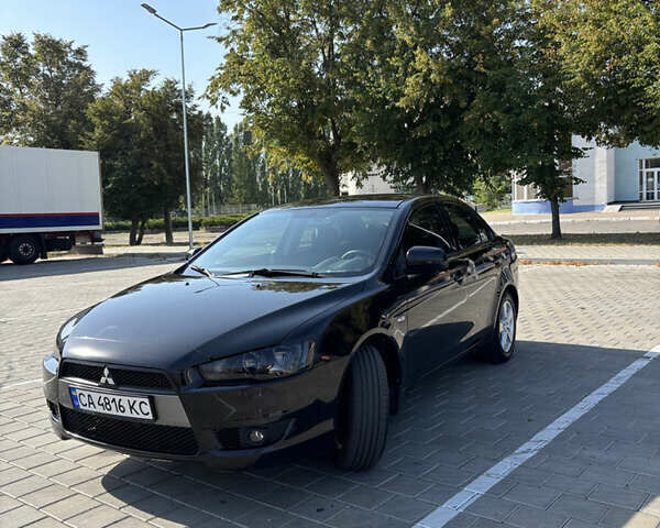 Черный Мицубиси Лансер, объемом двигателя 1.5 л и пробегом 215 тыс. км за 7500 $, фото 1 на Automoto.ua