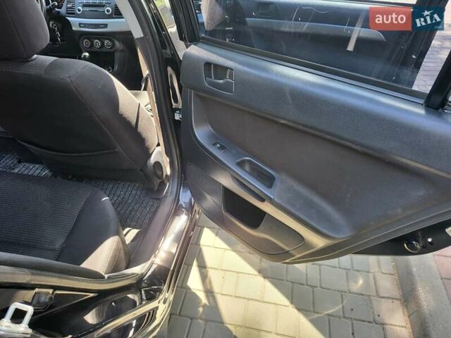 Чорний Міцубісі Lancer, об'ємом двигуна 1.5 л та пробігом 185 тис. км за 7300 $, фото 13 на Automoto.ua