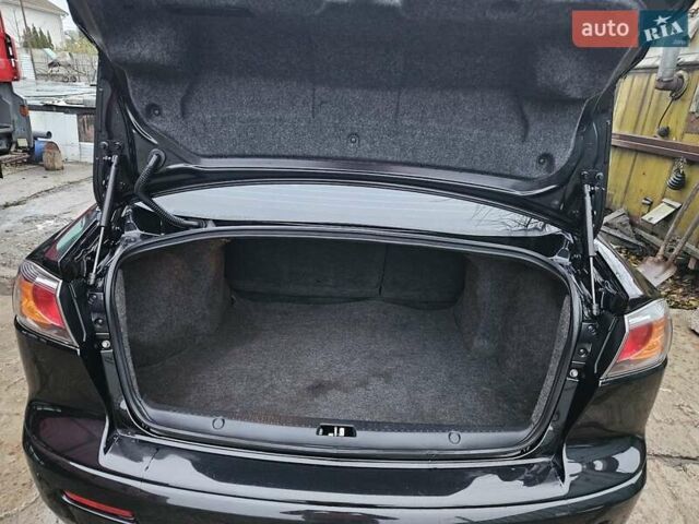 Черный Мицубиси Лансер, объемом двигателя 1.5 л и пробегом 222 тыс. км за 4900 $, фото 25 на Automoto.ua