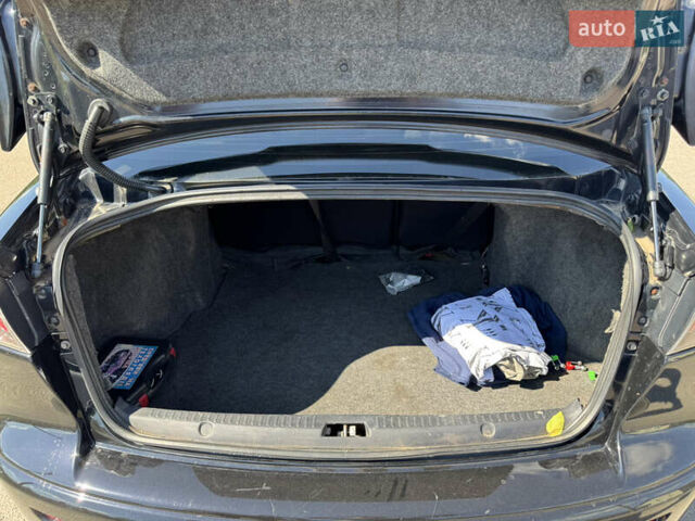 Черный Мицубиси Лансер, объемом двигателя 1.5 л и пробегом 230 тыс. км за 5400 $, фото 7 на Automoto.ua