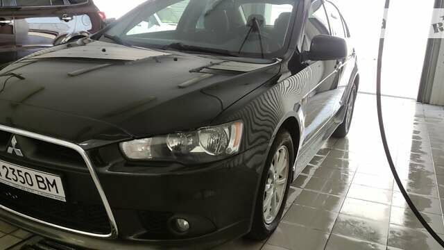 Чорний Міцубісі Lancer, об'ємом двигуна 1.59 л та пробігом 126 тис. км за 8600 $, фото 1 на Automoto.ua