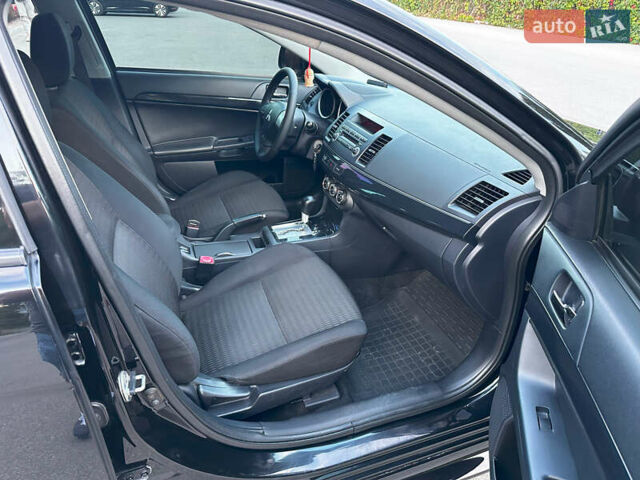 Чорний Міцубісі Lancer, об'ємом двигуна 1.59 л та пробігом 146 тис. км за 8950 $, фото 27 на Automoto.ua
