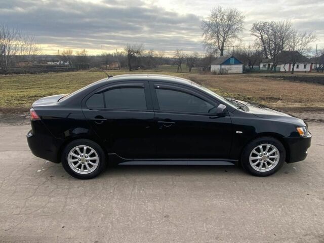 Чорний Міцубісі Lancer, об'ємом двигуна 2 л та пробігом 50 тис. км за 8300 $, фото 2 на Automoto.ua