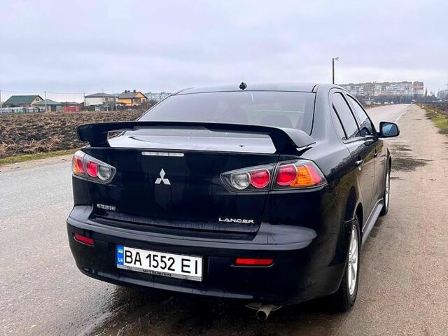 Чорний Міцубісі Lancer, об'ємом двигуна 2 л та пробігом 123 тис. км за 9000 $, фото 4 на Automoto.ua