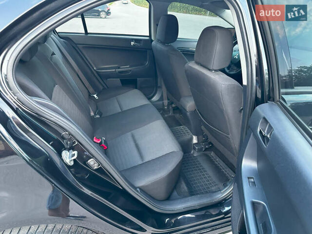 Чорний Міцубісі Lancer, об'ємом двигуна 1.59 л та пробігом 146 тис. км за 8950 $, фото 26 на Automoto.ua